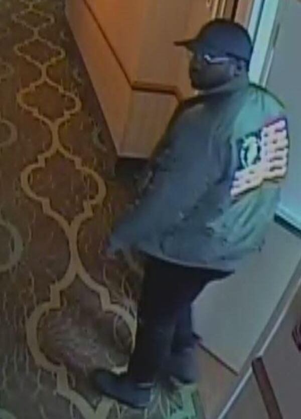 DeKalb County police say this man is a person of interest after a woman was strangled to death in a hotel room. (Credit: DeKalb police)