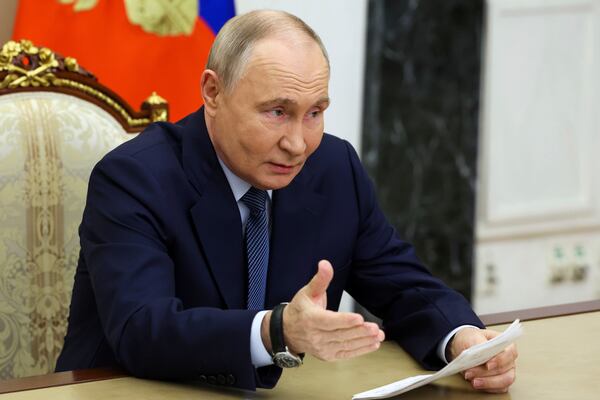 Russian President Vladimir Putin gestures while speaking during a meeting with the leadership of the Russian Ministry of Defense, representatives of the military-industrial complex and developers of missile systems at the Kremlin in Moscow, Russia, Friday, Nov. 22, 2024. (Vyacheslav Prokofyev/Sputnik, Kremlin Pool Photo via AP)