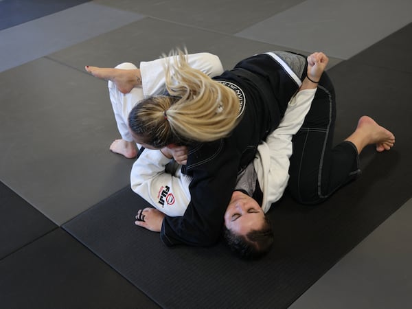 10/19/2021 -Marietta, Georgia: Officer Stacy Fowler trains at Borges Brazilian Jiu Jitsu gym in an effort to reduce use-of-force injuries. The Marietta police department now mandates weekly training sessions. (Tyson Horne / Tyson.Horne@ajc.com)