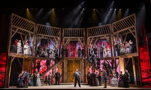 The wooden scaffold set design by Steven C. Kemp places the action in the 11th century, when the historical Macbeth ruled.