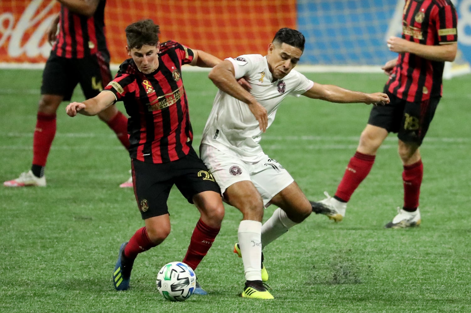 Atlanta United midfielder Emerson Hyndman (20) and Miami midfielder Victor Ulloa (13) battle for possession of the ball in the second half at Mercedes-Benz Stadium Saturday, September 19, 2020 in Atlanta. JASON GETZ FOR THE ATLANTA JOURNAL-CONSTITUTION