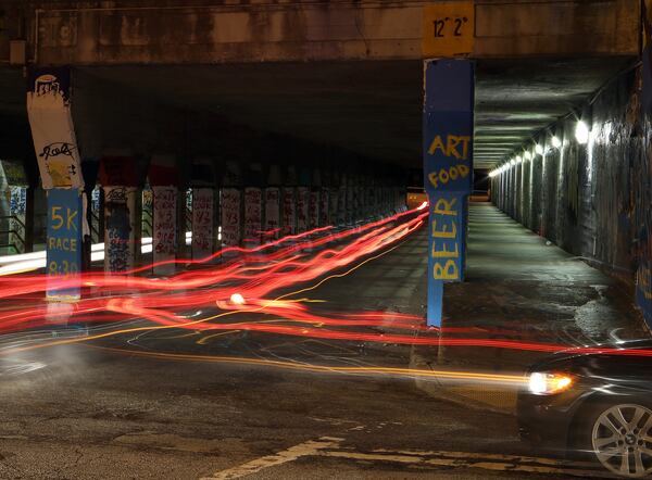 Cars make their way through the Krog Street tunnel, a 1913 tunnel linking Inman Park and Cabbagetown that is known for the constantly changing street art that covers it. BEN GRAY / BGRAY@AJC.COM