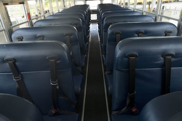 Each propane school bus comes equipped with seat belts for students at the North Fulton County Transportation office in Alpharetta , Friday, June 29, 2018. ALYSSA POINTER/ALYSSA.POINTER@AJC.COM