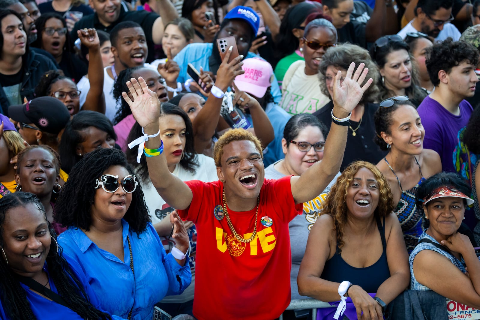 Marcus Gully, center, cheers at a rally for Democratic presidential nominee Vice President Kamala Harris on Friday, Oct. 25, 2024, in Houston. (AP Photo/Annie Mulligan)