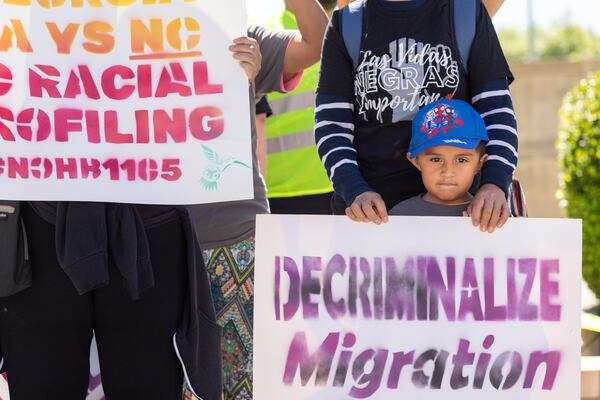 Emir Gonzalez (right), 4, is seen at a protest against HB 1105, which would would mandate that local law enforcement work more closely with ICE, at Liberty Plaza in front of the Capitol in Atlanta on Wednesday, May 1, 2024. (Arvin Temkar / AJC)