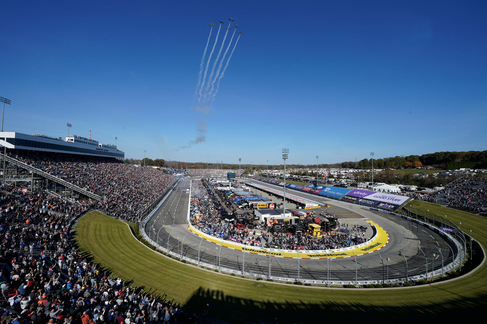 Airplanes perform a flyover before a NASCAR Cup Series auto race at Martinsville Speedway in Martinsville, Va., Sunday, Nov. 3, 2024. (AP Photo/Chuck Burton)