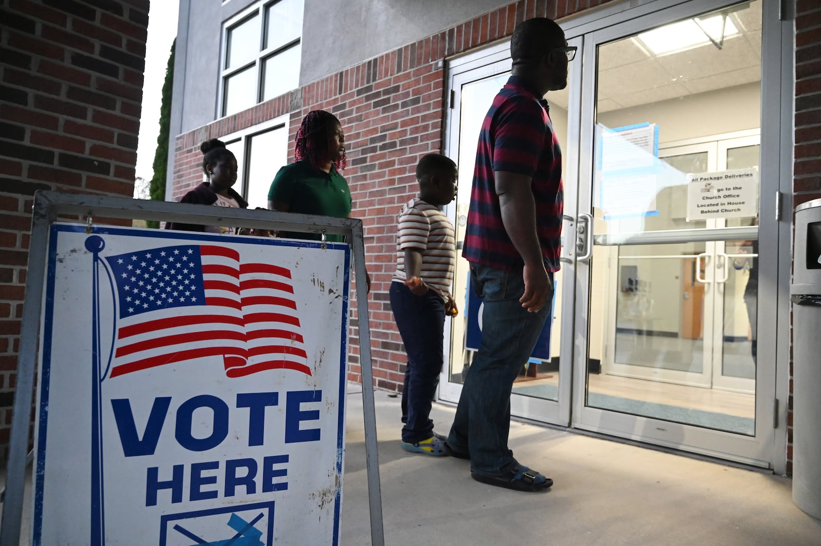 Gwinnett County voters arrive on Election Day at Gracepointe Church of the Nazarene in Loganville.(Hyosub Shin / AJC)