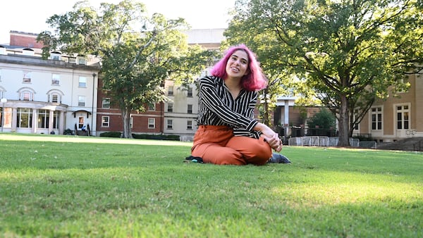 University of Georgia first year student Yara Manasrah sits on the grass near Reed Hall one of her favorite spots on the campus in Athens on Friday, October 16, 2020. (Hyosub Shin / Hyosub.Shin@ajc.com)