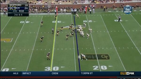 Offense in a standard alignment, with A-back Broderick Snoddy at the left wingback spot and Charles Perkins to the right. Wofford is lined up with three down linemen and four linebackers.