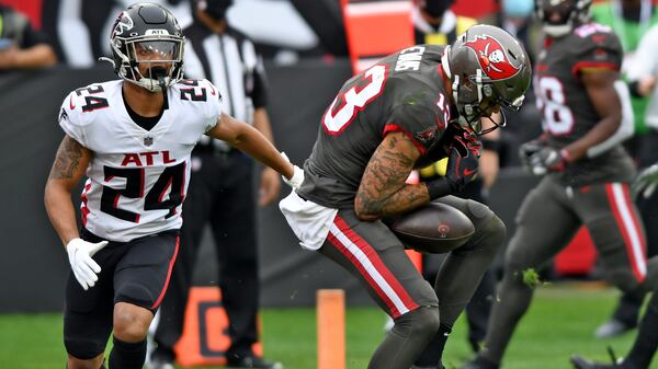 Tampa Bay Buccaneers wide receiver Mike Evans (13) can't hang onto the ball after getting around Atlanta Falcons cornerback A.J. Terrell (24) in the end zone during the first half Sunday, Jan. 3, 2021, in Tampa, Fla. Evans injured his knee on the play and left the game. (Jason Behnken/AP)