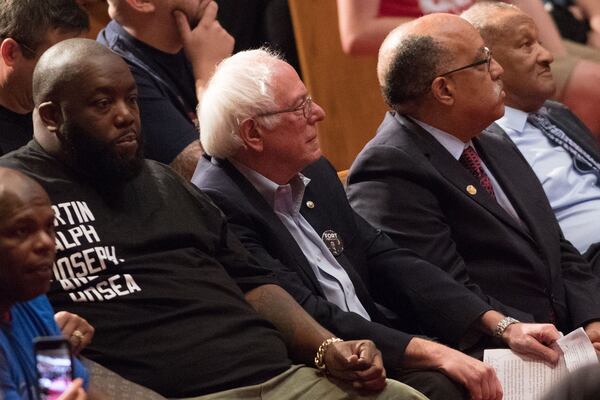 Rap artist Killer Mike (left),  Senator  Bernie Sanders (center) and former Atlanta mayoral candidate Vincent Fort sit together during a campaign rally for Fort at Saint Phillip AME Church in 2017.  Sanders is depending on young voters and is hoping that translates inton young black voters. BRANDEN CAMP / SPECIAL