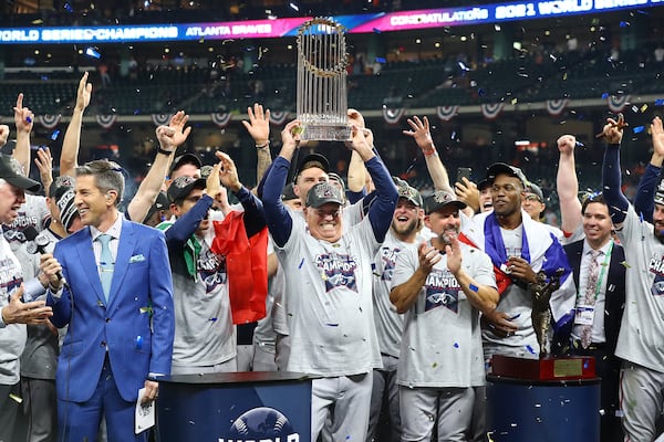 Braves manager Brian Snitker hoists the World Series trophy after beating the Astros in game 6 of the World Series on Tuesday, Nov. 2, 2021, in Houston.   “Curtis Compton / Curtis.Compton@ajc.com”