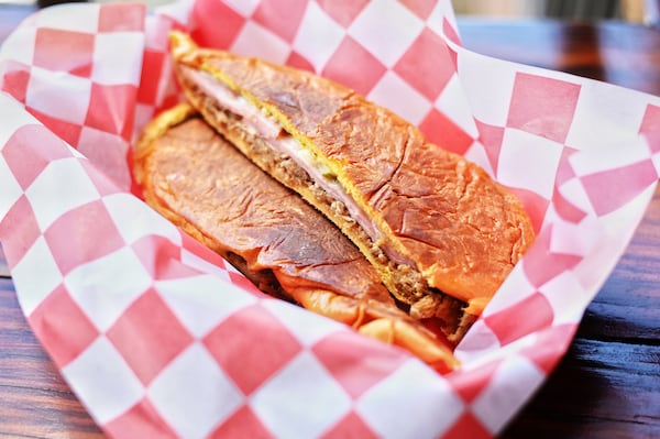 D'Cuban at Marietta Square Market makes a rich media noche sandwich. Henri Hollis/henri.hollis@ajc.com