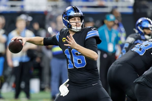 Detroit Lions quarterback Jared Goff (16) passes against the Buffalo Bills during the first half of an NFL football game, Sunday, Dec. 15, 2024, in Detroit. (AP Photo/Duane Burleson)