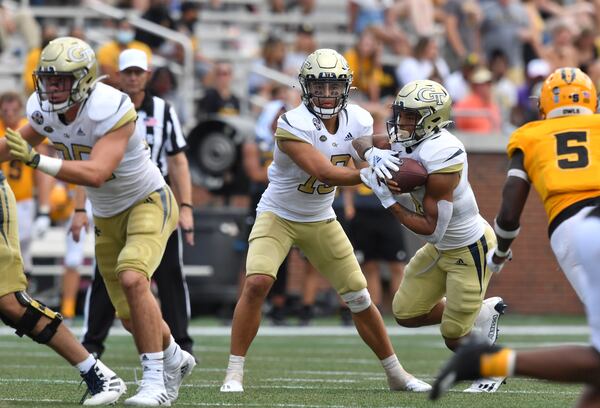 Georgia Tech quarterback Jordan Yates (13) makes a handoff to running back Dontae Smith (4) during the second half Saturday, Sept. 11, 2021, at Bobby Dodd Stadium in Atlanta. (Hyosub Shin / Hyosub.Shin@ajc.com)