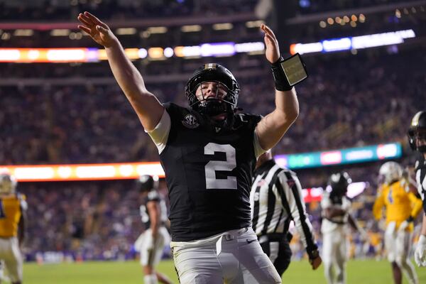 Vanderbilt quarterback Diego Pavia (2) celebrates a touchdown in the second half of an NCAA college football game against LSU in Baton Rouge, La., Saturday, Nov. 23, 2024. LSU won 24-17. (AP Photo/Gerald Herbert)