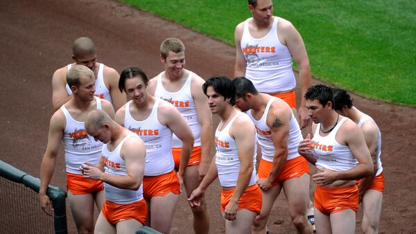 Rookie members of the San Diego Padres baseball team are dressed like Hooters restaurant workers, as part of rookie hazing after the Padres' 1-0 loss to the Colorado Rockies in a baseball game at Coors Field in Denver.