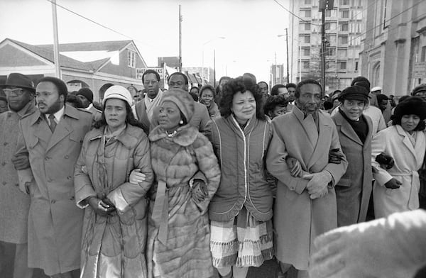 Arm in arm, Martin Luther King III, Coretta Scott King, Christine King Farris, Alveda King and Dick Gregory leader a march from the Ebenezer Baptist Church in Atlanta to the Federal building in honor of Martin Luther King Jr.’s birthday, Tuesday, Jan. 15, 1985. (AP Photo/Ric Reld)