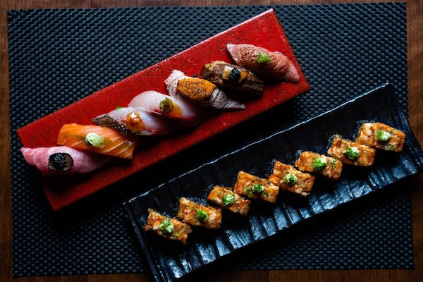 A selection of nigiri (top) and the Roku roll at District M in Sandy Springs. CONTRIBUTED BY HENRI HOLLIS