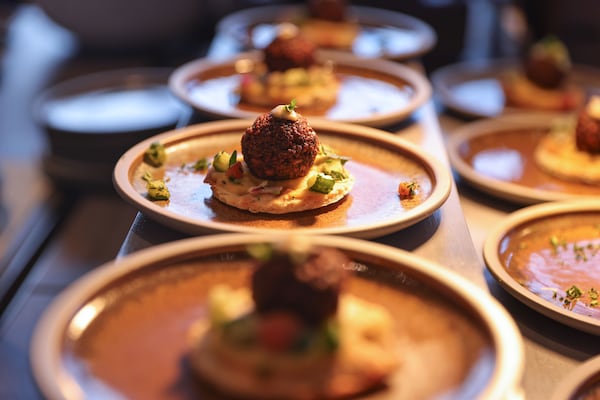 Views of food items on the menu at Gallagher Club and Lounge at Molly B’s at Mercedes-Benz Stadium in Atlanta shown on Wednesday, Sept. 4, 2024. The lounge space features food stations, including a sushi bar, a chef’s table with rotating dishes and full bar.  (Natrice Miller/ AJC)