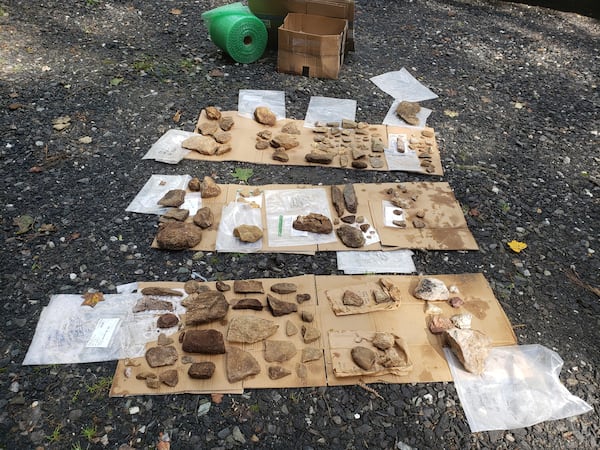 This Aug. 18, 2022, photo provided by Scott Ashcraft shows cultural artifacts that were cleaned after being uncovered from sloped terrain during survey work in the Pisgah National Forest near Celo, North Carolina. (Scott Ashcraft via AP)