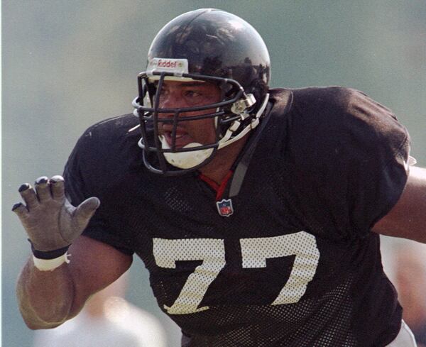 Atlanta Falcons defensive end Pellom McDaniels (77) runs downfield during practice in this Wednesday, Aug. 4, 1999 file photo, at Furman University in Greenville, South Carolina. While playing professional football, McDaniels was also an artist and entrepreneur, inventor and philosopher, and considered a civic crusader and willing role model, dreamer and renaissance man. AP PHOTO / MARY ANN CHASTAIN