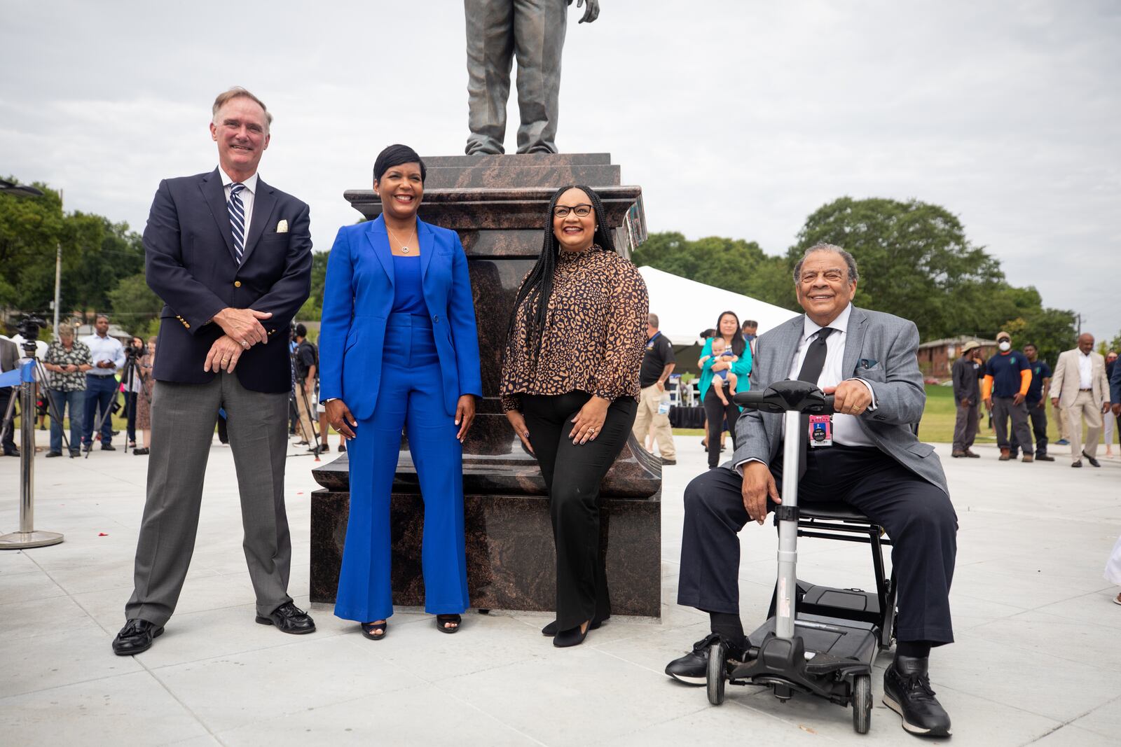 Rodney Cook Jr., the founder of the National Monuments Foundation, Atlanta Mayor Keisha Bottoms, Rep. Nikema Williams and Ambassador Andrew Young pose for a photo at Rodney Cook Sr. Park in Vine City in Atlanta, GA., on Wednesday, June 7, 2021. (Photo/ Jenn Finch for the Atlanta Journal-Constitution)