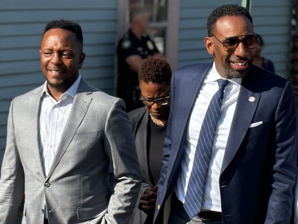 Mayor Andre Dickens (center) tours the Vine City neighborhood in 2024 with his senior advisor Courtney English. The two officials last week presented a sweeping new vision of transit in Atlanta to MARTA's board. (Matt Reynolds/AJC)