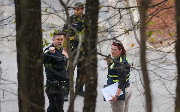 Authorities are on the scene at an apartment on Bent Creek Way. JOHN SPINK / JSPINK@AJC.COM