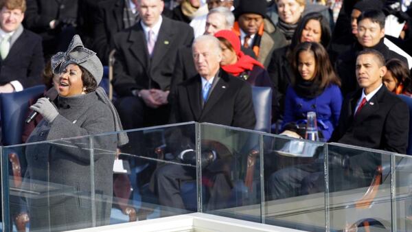 Aretha Franklin performs during the inauguration ceremony as Joe Biden, left, Barack Obama, right, and his daughter Malia Obama watch at the U.S. Capitol in Washington on Jan. 20, 2009. (AP Photo/Elise Amendola, File)