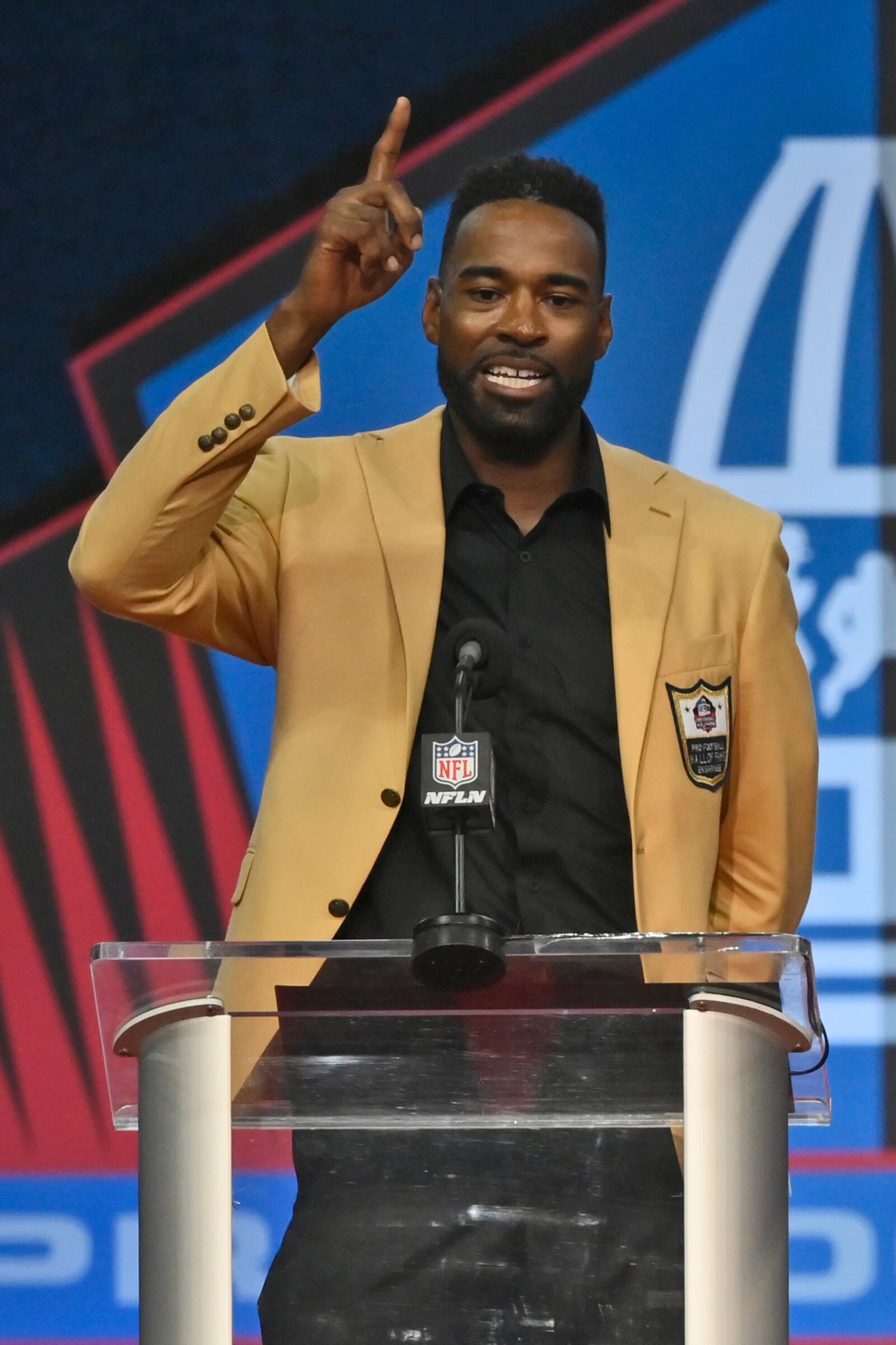 Calvin Johnson, a member of the Pro Football Hall of Fame Class of 2021, speaks during the induction ceremony at the Pro Football Hall of Fame, Sunday, Aug. 8, 2021, in Canton, Ohio. (David Richard/AP)