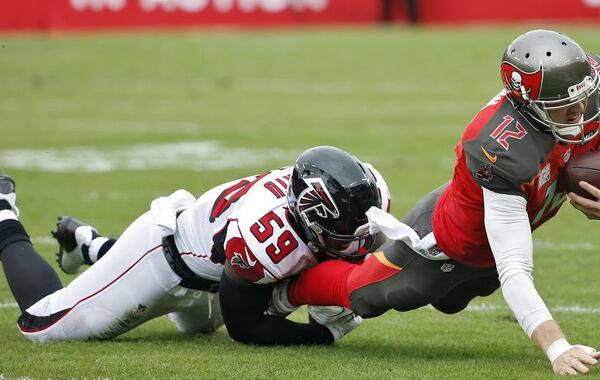 Falcons linebacker Joplo Bartu making a stop. (Associated Press)