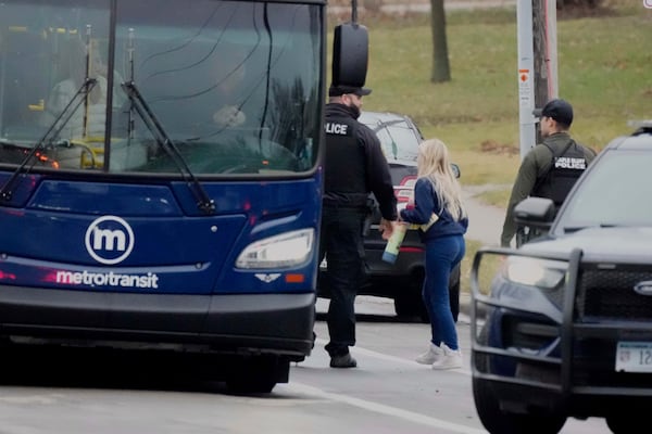 A student gets on a bus for the reunification center after multiple injuries were reported following a shooting at the Abundant Life Christian School, Monday, Dec. 16, 2024. (AP Photo/Morry Gash)