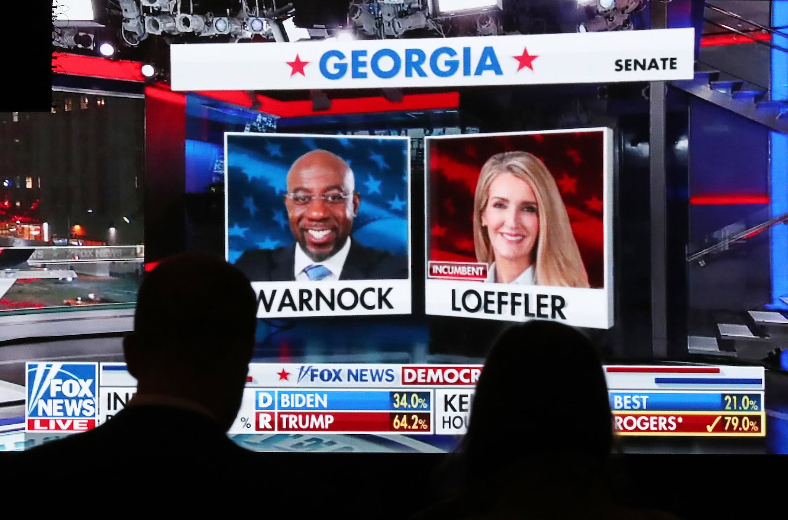 Republican supporters watch returns for Democratic U.S. Senate candidate Raphael Warnock and Republican incumbent Kelly Loeffler come in at the Georgia Republican Party Election Night Celebration Party at the Intercontinental Buckhead Atlanta hotel on Tuesday, Nov. 3, 2020, in Atlanta. (Curtis Compton/Atlanta Journal-Constitution/TNS)