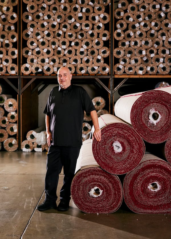 
                        Steve Olive, the co-founder of Event Carpet Pros, with rolls of red carpet his company installed at the Dolby Theater for the Oscars in Los Angeles, on Feb. 21, 2025. Olive, who has worked in the event carpet business for more than three decades, is the man the Academy trusts to get its iconic rug just right. (Jennelle Fong/The New York Times)
                      