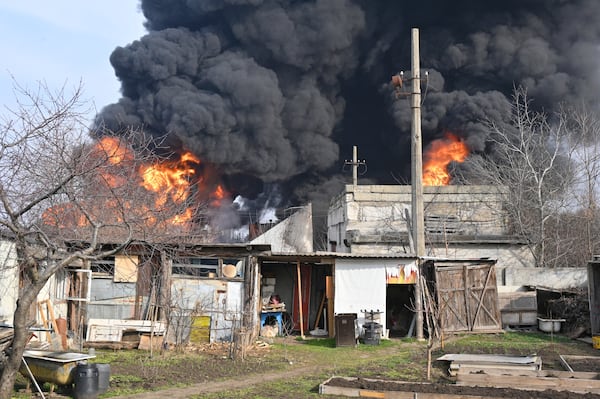 Fuel reservoirs fire following a Russian drone attack near Odesa, Ukraine, Tuesday, March 11, 2025. (AP Photo/Michael Shtekel)