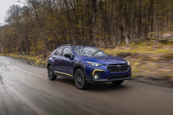 This photo provided by Subaru shows the 2025 Crosstrek. The Crosstrek's outdoorsy design also works well for driving in the urban jungle. (Courtesy of Subaru of North America via AP).