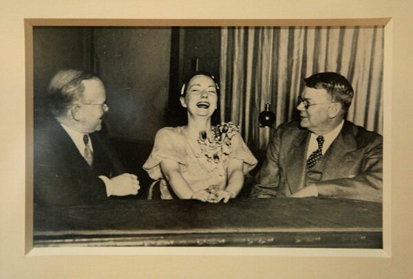 In an old photograph, Margaret Mitchell (center) shares a laugh with two associates from her newspaper days, Lambdin Kay, former manager of WSB radio (at left), and John Paschall, editor emeritus of the Atlanta Journal, at the Atlanta Pulitzer Prize Dinner in May 1937. This photograph was shown at “The Lost ‘Gone With the Wind’ Manuscript” exhibit at the Atlanta History Center on May 25, 2011. CONTRIBUTED BY JASON GETZ