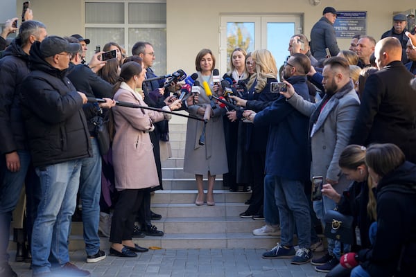 Moldova's President Maia Sandu speaks to the media after casting her vote during a presidential election runoff, in Chisinau, Moldova, Sunday, Nov. 3, 2024. (AP Photo/Vadim Ghirda)