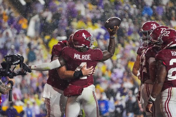 Alabama quarterback Jalen Milroe (4) celebrates his touchdown carry in the first half an NCAA college football game against LSU in Baton Rouge, La., Saturday, Nov. 9, 2024. (AP Photo/Gerald Herbert)