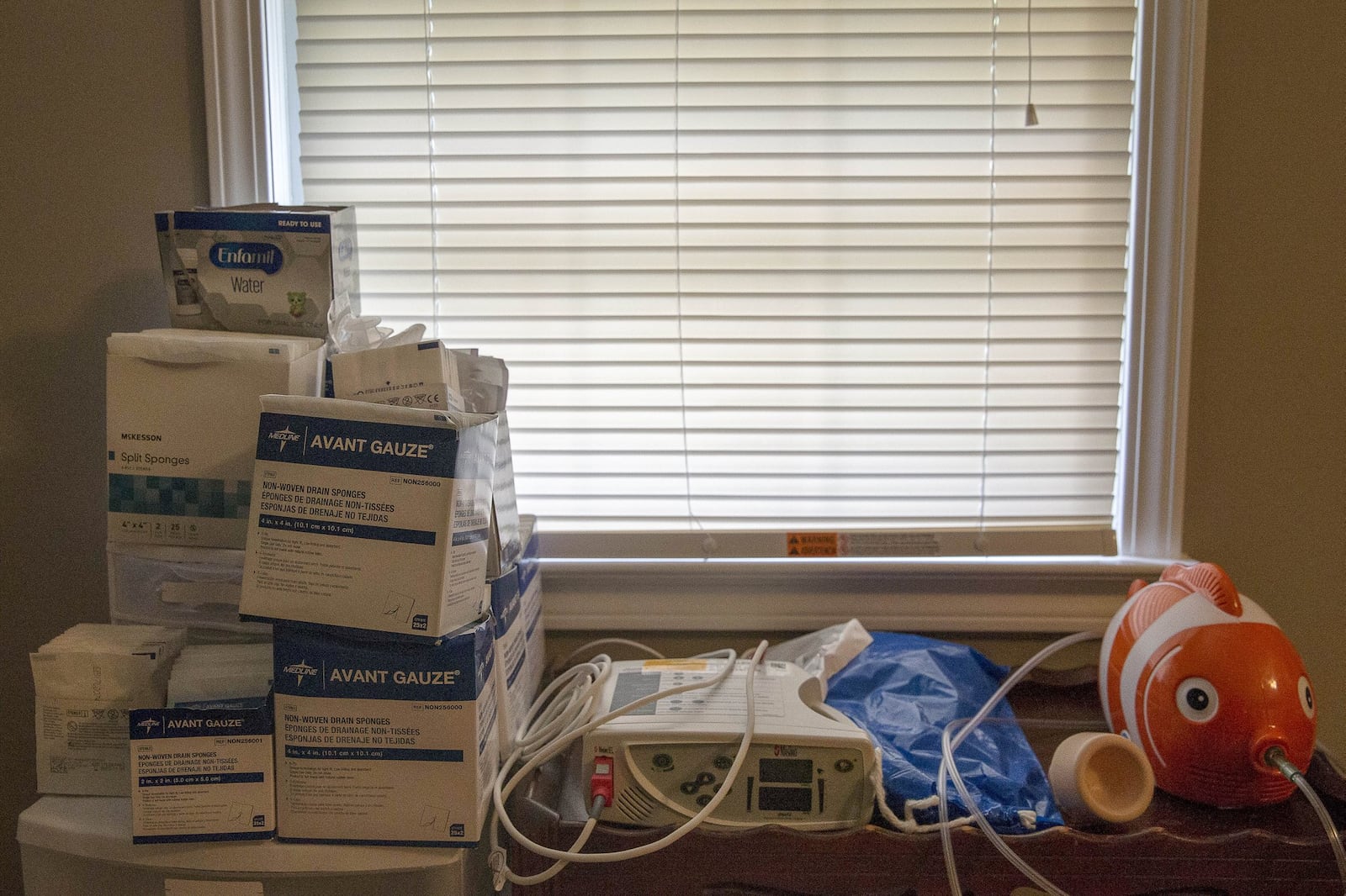 Medical equipment is housed in the master bedroom of the Walker home in Lawrenceville. Easton sleeps in the bedroom with his parents. An assortment of medical equipment sits next to Rebecca and Scott’s bed for easy access to Easton throughout the night. ALYSSA POINTER/ATLANTA JOURNAL-CONSTITUTION