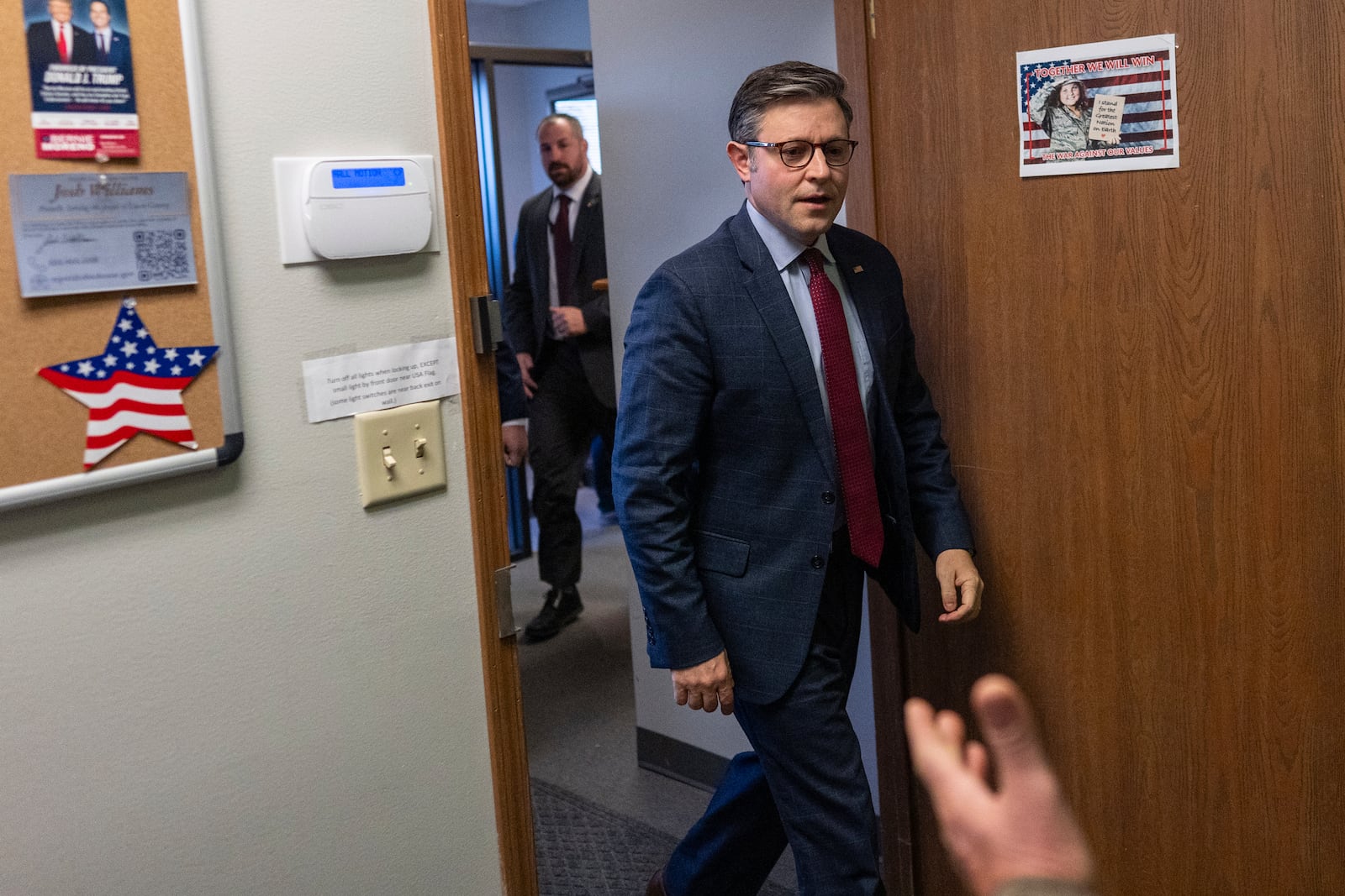 Speaker of the House Mike Johnson, R-La., is greeted as he arrives to speak at a campaign event at the Lucas County Republican Party headquarters in Holland, Ohio, Saturday, Oct. 26, 2024. (AP Photo/Carolyn Kaster)