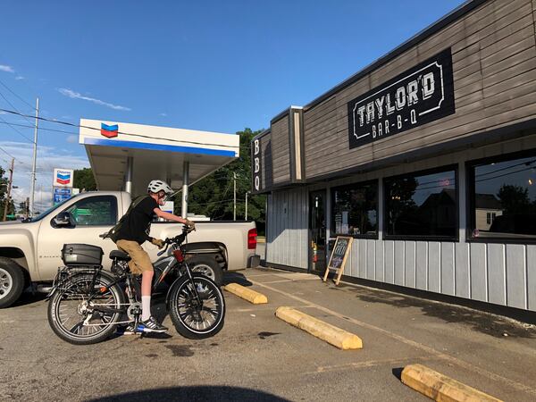 A customer departs Taylor’d Bar-B-Q on College Avenue in Avondale Estates. CONTRIBUTED BY WENDELL BROCK
