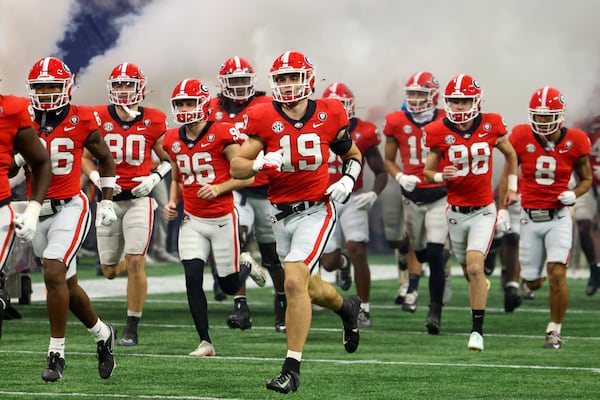 Georgia Bulldogs tight end Brock Bowers (19) runs onto the field with teammates before the SEC Championship game against the LSU Tigers at Mercedes-Benz Stadium, Saturday, December 3, 2022, in Atlanta. Georgia won 50-30. (Jason Getz / Jason.Getz@ajc.com)