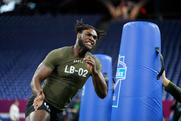 Alabama linebacker Will Anderson runs a drill at the NFL football scouting combine in Indianapolis, Thursday, March 2, 2023. (AP Photo/Michael Conroy)