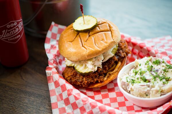 Hattie B’s Hot Chicken sandwich with fried chicken breast, cole slaw, Nashville comeback sauce, kosher pickle,  with red skin potato salad. Photo credit- Mia Yakel.