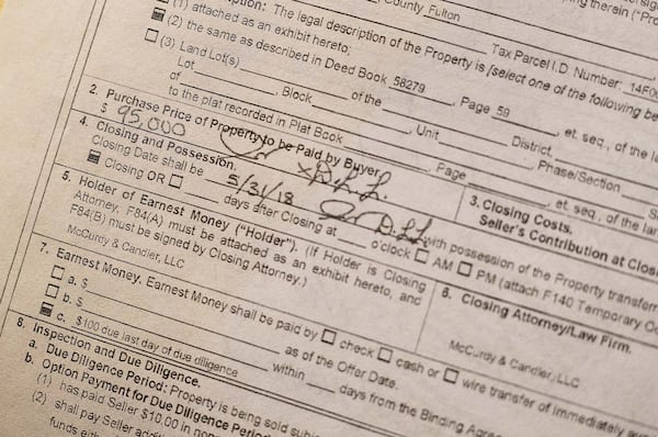 Complaints about real estate wholesalers have skyrocketed in recent years. Often, seniors call Atlanta Legal Aid Society for help after they sign a sales contract, making it difficult to help them. West Atlanta resident Debbie McGauley signed this contract after 20 minute meeting with an investor, she said. ALYSSA POINTER / ALYSSA.POINTER@AJC.COM