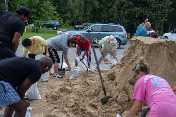 Savannah residence fills sand bags with sand at the Savannah Fire Station #7 on Sunday, August 4, 2024 in Savannah, GA. (AJC Photo/Katelyn Myrick)