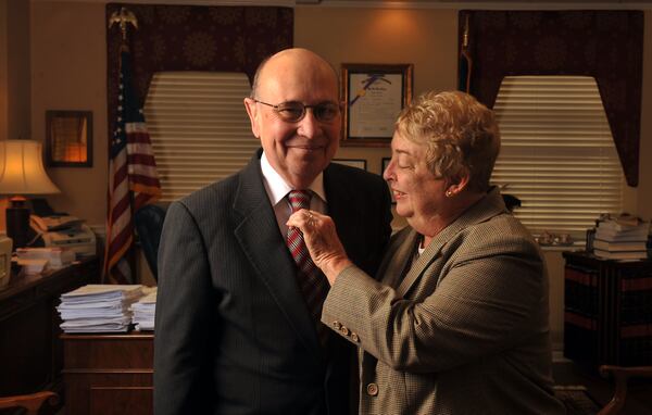 Former Georgia Supreme Court Chief Justice George Carley, who died Thursday, is pictured here with his wife Sandy in November 2009.  Carley was well known for always wearing a coat and tie, including bringing backup ties to Georgia football games in case the first one proved unlucky.   (Brant Sanderlin/bsanderlin@ajc.com)