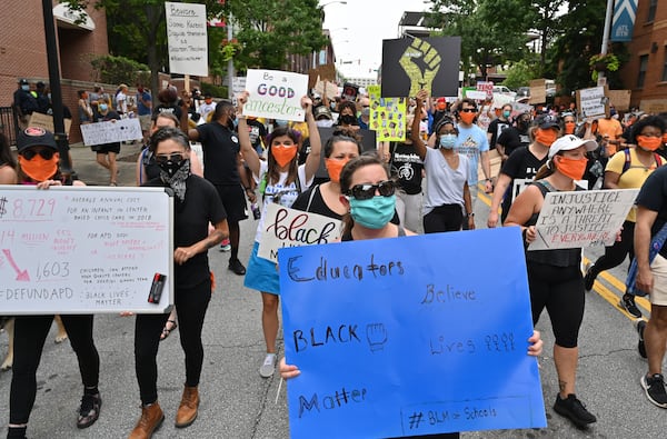  Educators march past Atlanta Public Schools Headquarters after they made a short stop on Friday, June 26, 2020. The Educators for Black Lives March starts at 3 p.m. at Rosa L. Burney Park on Windsor Street south of downtown. Organizers plan brief stops outside the city jail, the headquarters for Atlanta Public Schools, the Georgia Department of Education and Atlanta City Hall, before arriving at their destination: Liberty Plaza across the street from the Georgia State Capitol. 